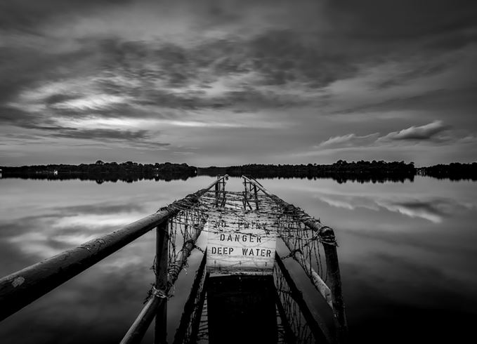Deep water danger sign at lake